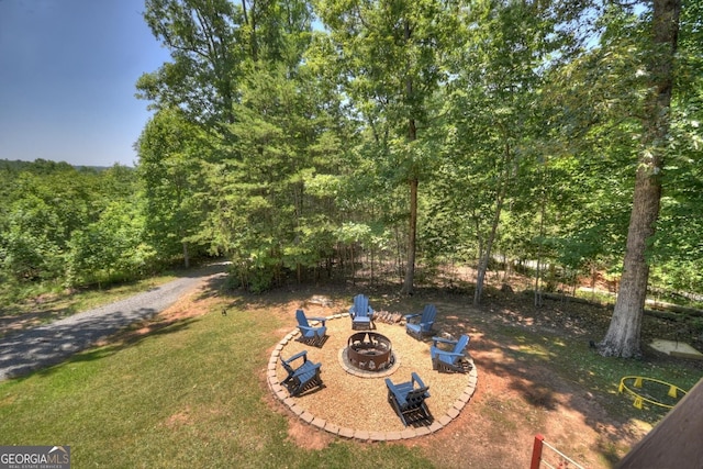 view of yard with an outdoor fire pit