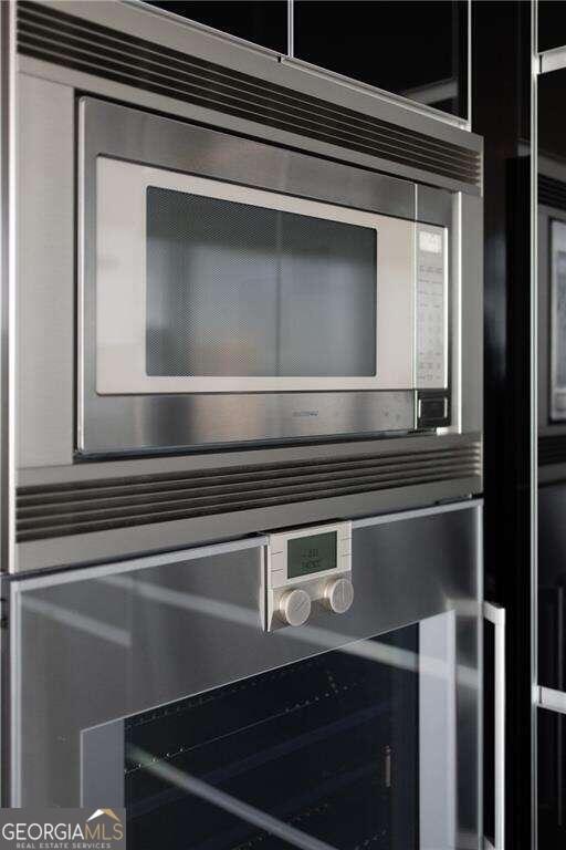 room details featuring appliances with stainless steel finishes