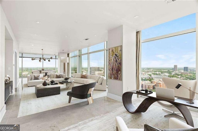 living room featuring floor to ceiling windows and an inviting chandelier