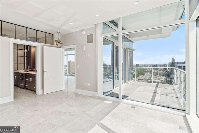 interior space featuring floor to ceiling windows