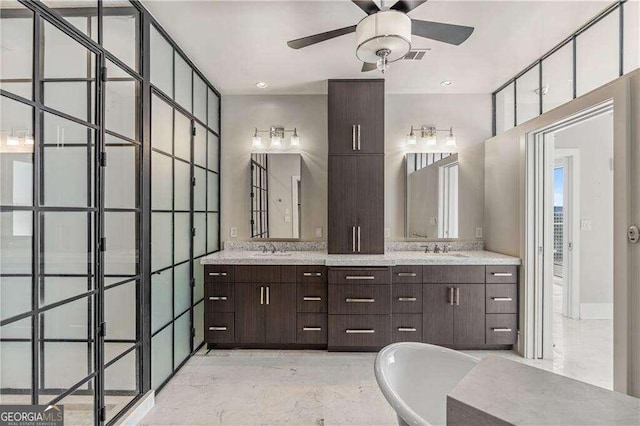 bathroom with a bath, vanity, and ceiling fan