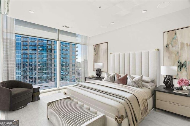 bedroom with floor to ceiling windows