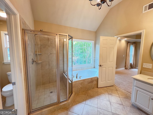 full bathroom with tile patterned flooring, separate shower and tub, vaulted ceiling, toilet, and vanity