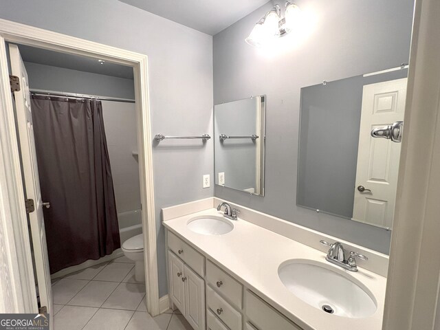 full bathroom with tile patterned flooring, shower / bath combo, toilet, and vanity