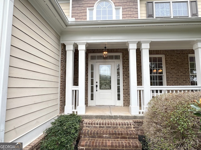 property entrance featuring a porch