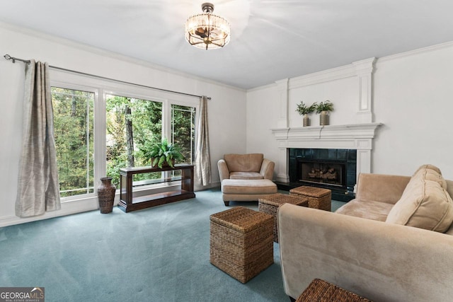 carpeted living room featuring a healthy amount of sunlight, ornamental molding, and a tiled fireplace