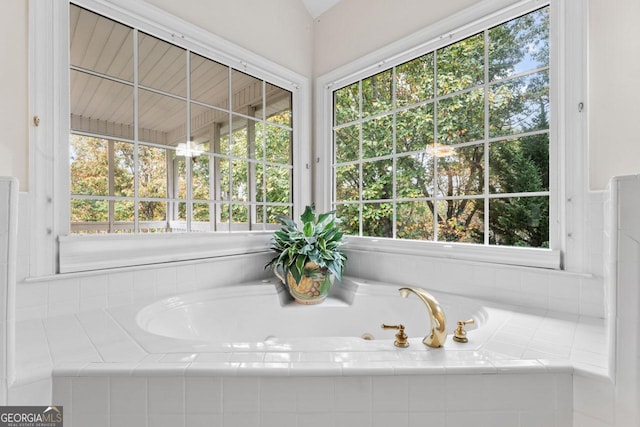 bathroom with tiled tub