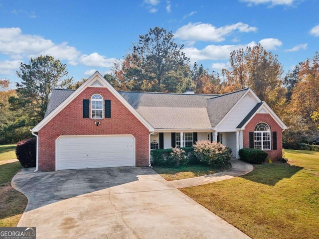 view of front of home with a garage and a front yard