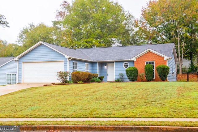 ranch-style home with a front yard and a garage