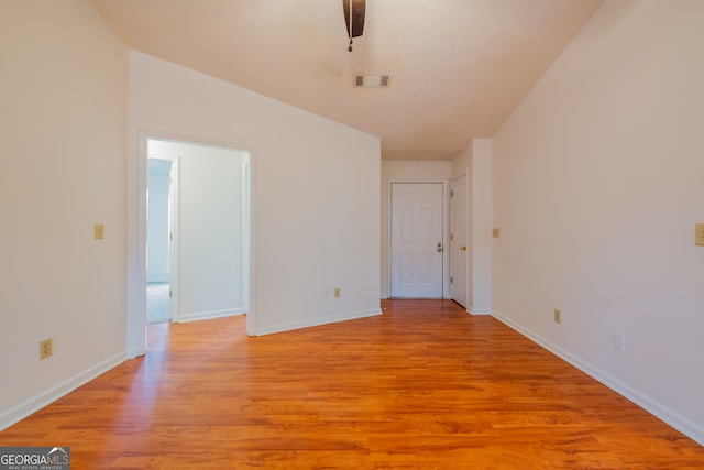 spare room featuring ceiling fan and light hardwood / wood-style floors