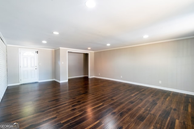 unfurnished room with ornamental molding and dark hardwood / wood-style flooring