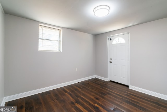 entryway with dark hardwood / wood-style flooring