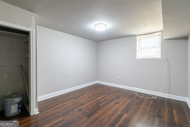 basement featuring dark hardwood / wood-style flooring