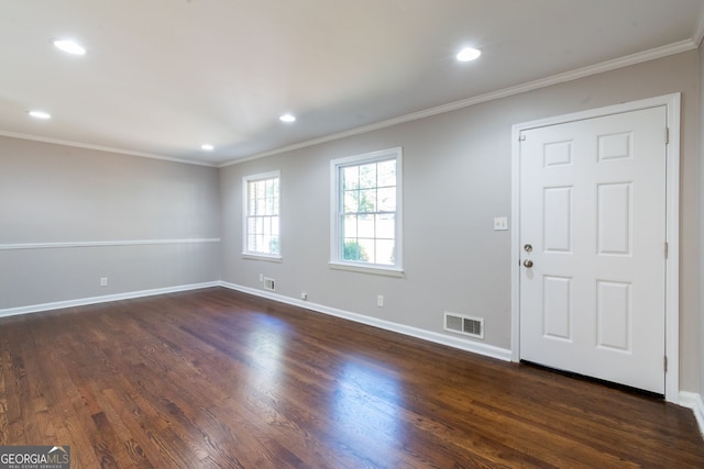 foyer featuring ornamental molding and dark wood-type flooring