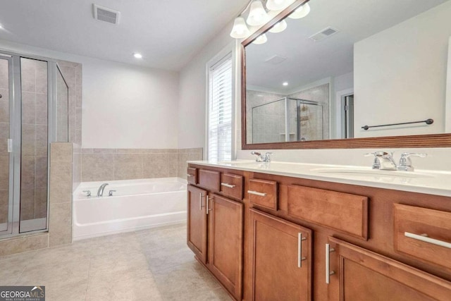 bathroom featuring vanity, tile patterned floors, and plus walk in shower