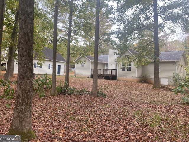 exterior space featuring a wooden deck