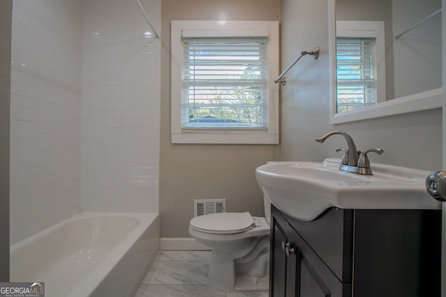 full bathroom with vanity, toilet, and tiled shower / bath