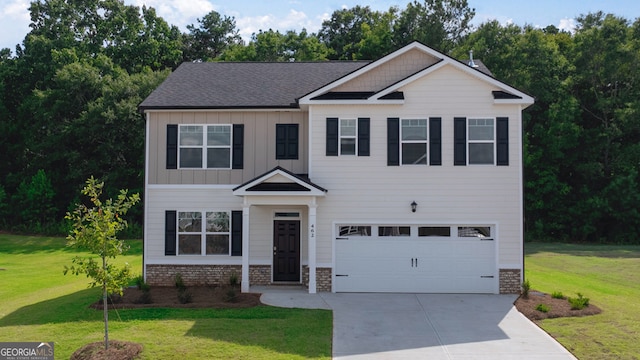 craftsman house featuring a garage and a front yard