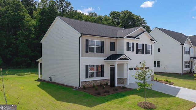 view of front facade with a garage and a front yard