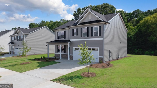 view of front of property featuring a garage and a front lawn