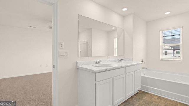 bathroom featuring vanity and a bathtub