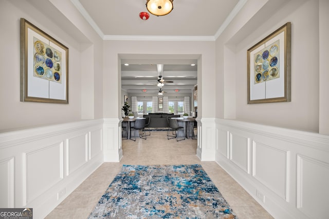 corridor featuring crown molding, light tile patterned floors, and beam ceiling