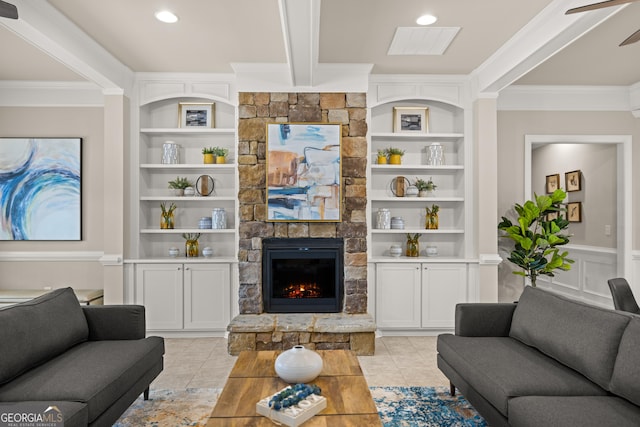 tiled living room featuring crown molding, ceiling fan, beam ceiling, a fireplace, and built in shelves