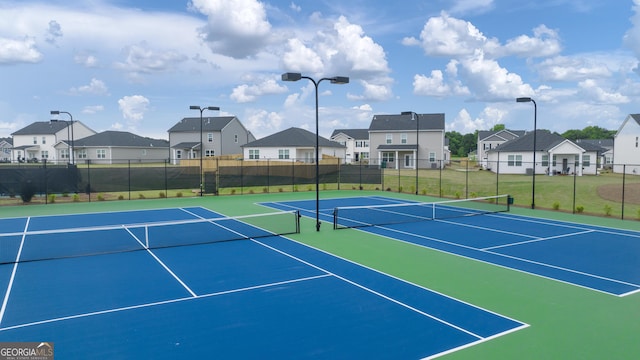 view of sport court with basketball hoop