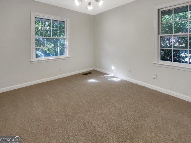 828 Pinevalley Dr, Forest Park, GA 30297 - unfurnished room with carpet floors, baseboards, and healthy amount of natural light