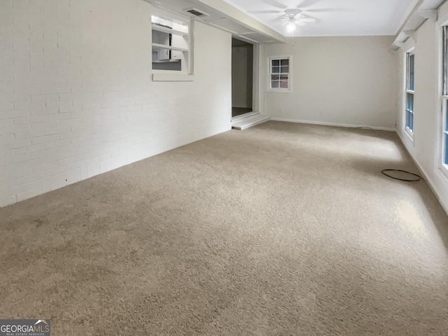 828 Pinevalley Dr, Forest Park, GA 30297 - carpeted empty room with ceiling fan and brick wall
