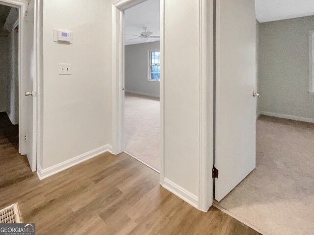 hall with light wood-type flooring