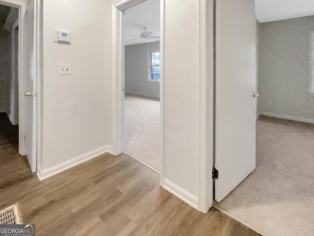 828 Pinevalley Dr, Forest Park, GA 30297 - corridor with wood finished floors and baseboards