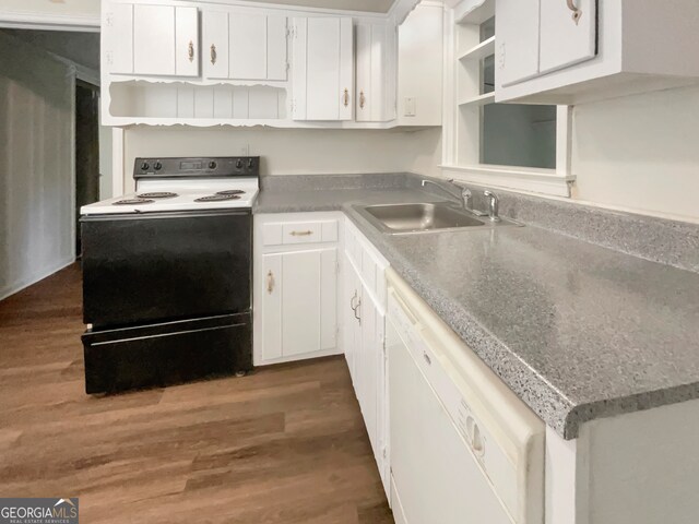 kitchen with dark wood-type flooring, white appliances, sink, and white cabinets