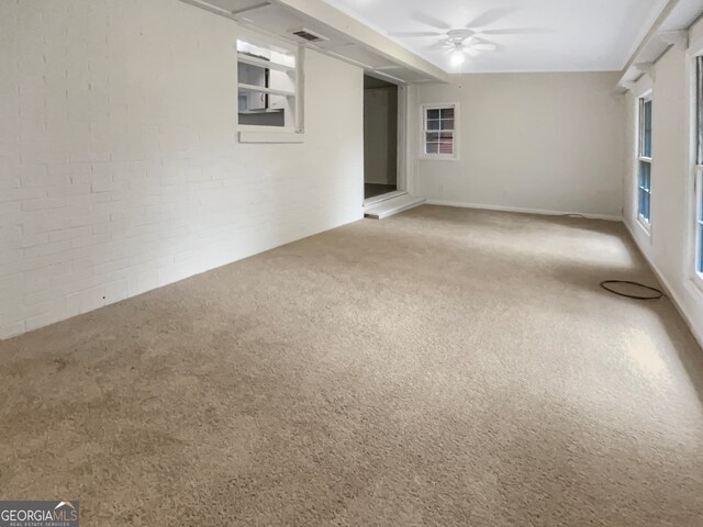 empty room with carpet floors and ceiling fan