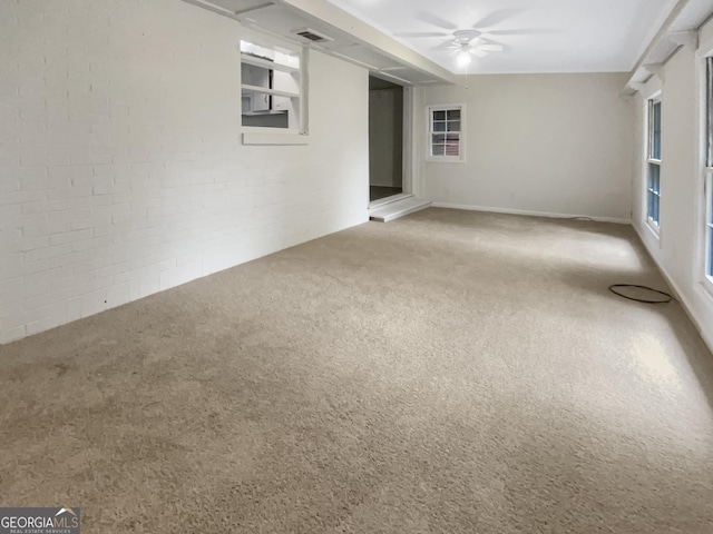 828 Pinevalley Dr, Forest Park, GA 30297 - empty room featuring carpet, ceiling fan, and brick wall