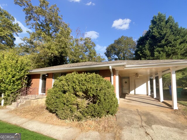 828 Pinevalley Dr, Forest Park, GA 30297 - view of front of house with brick siding, concrete driveway, and an attached carport