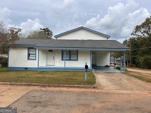 view of front facade with a front yard, a carport, and a porch