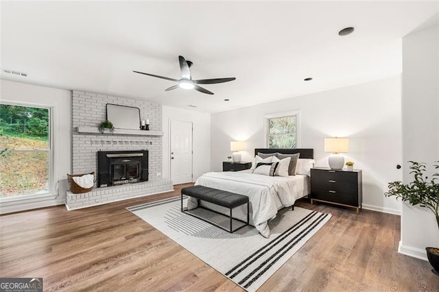 bedroom with ceiling fan and wood-type flooring