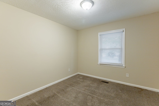 3730 Douglas Ridge Trl, Douglasville, GA 30135 - spare room featuring carpet, baseboards, and a textured ceiling