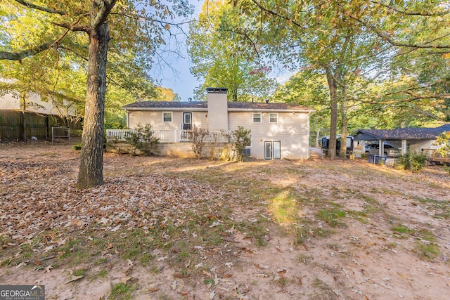 3730 Douglas Ridge Trl, Douglasville, GA 30135 - back of house with fence and a chimney