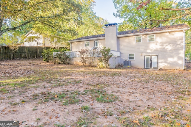 3730 Douglas Ridge Trl, Douglasville, GA 30135 - rear view of property featuring fence, a chimney, and central AC unit