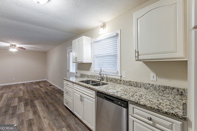 kitchen with sink, dark hardwood / wood-style floors, a textured ceiling, white cabinets, and dishwasher