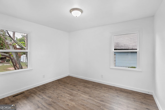 empty room featuring hardwood / wood-style flooring