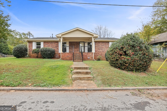 view of front of home with a porch and a front yard