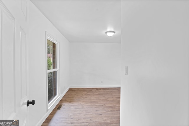 unfurnished room featuring wood-type flooring