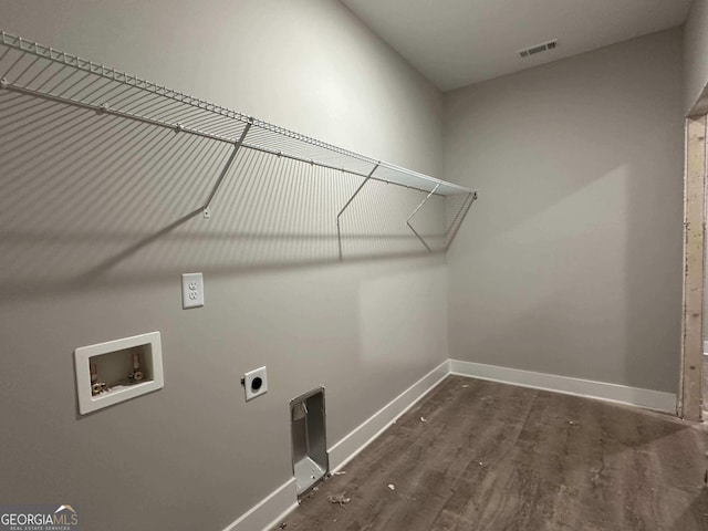 clothes washing area featuring dark hardwood / wood-style flooring, electric dryer hookup, and washer hookup