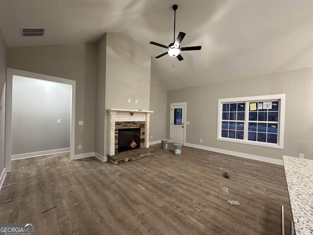 unfurnished living room featuring a fireplace, high vaulted ceiling, ceiling fan, and dark hardwood / wood-style floors