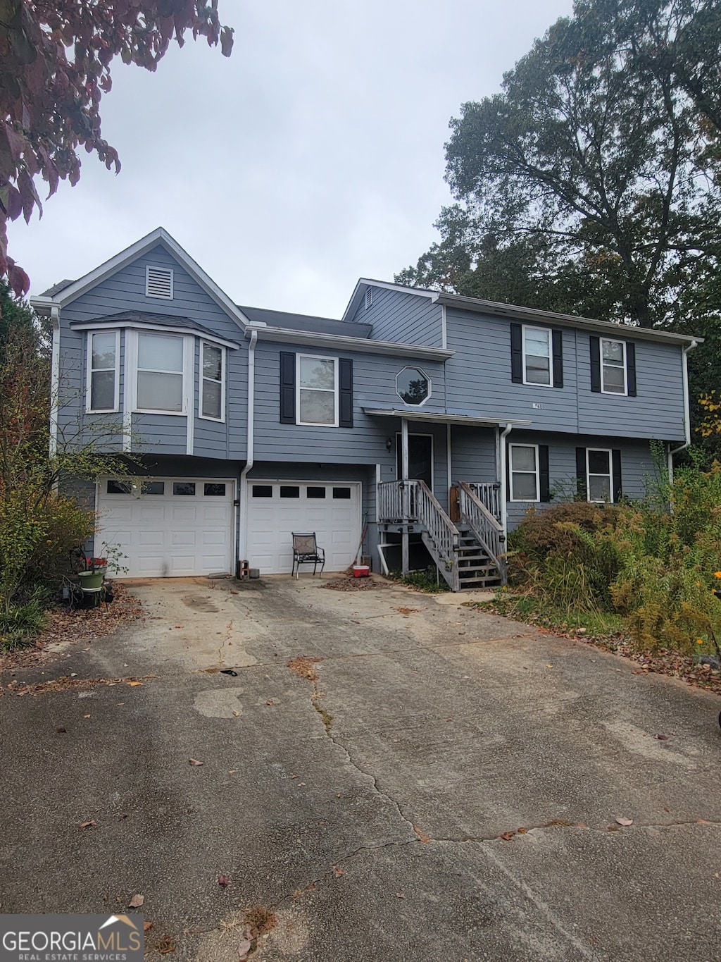 raised ranch featuring a garage