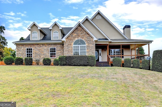 view of front of house featuring a front yard and covered porch