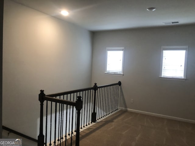 stairway with carpet floors